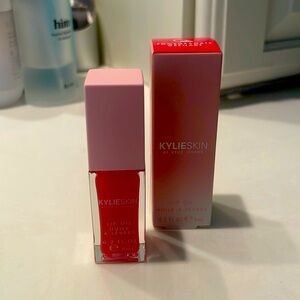 Kylie Skin Lip Oil in Pomegranate Grenade; .2 Fl oz
